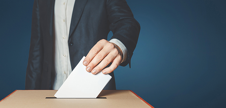 A ballot paper is placed in the ballot box